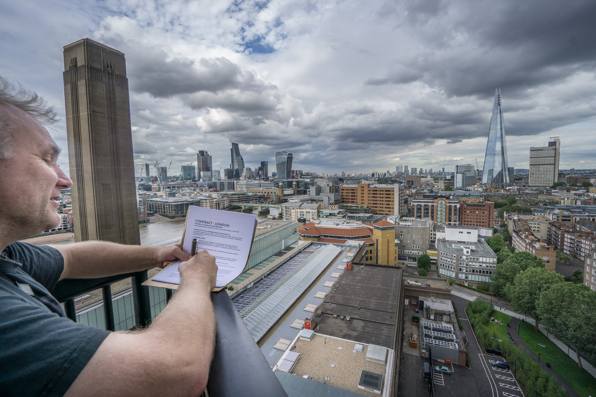 George, London author signing his contract high above London on the new Switch House building at the Tate Modern.